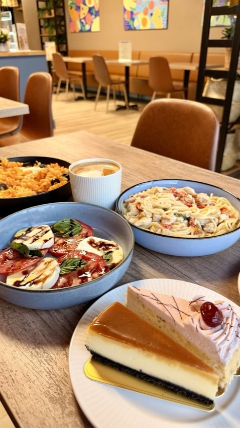 Fusilli pasta with olives and mozzarella served with iced coffee and caprese salad at Wish Delish