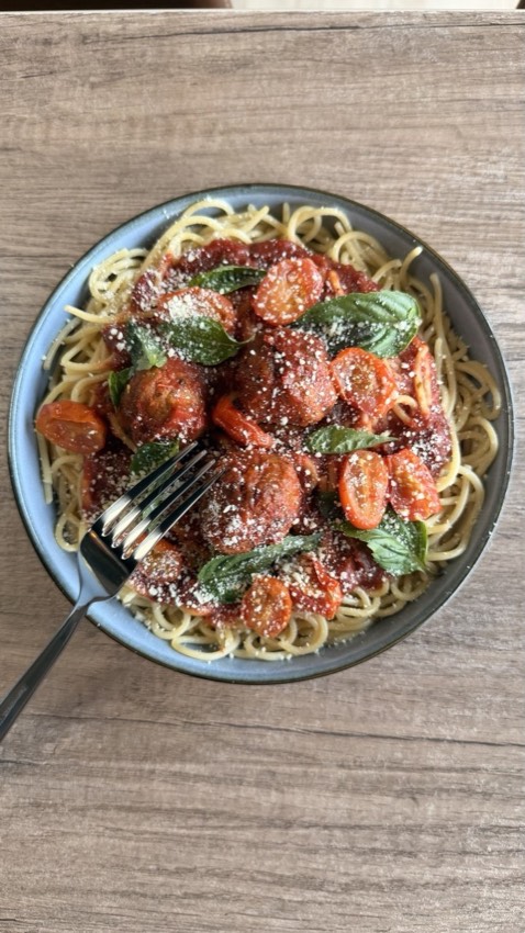 Spaghetti with meatballs, cherry tomatoes and basil at Wish Delish